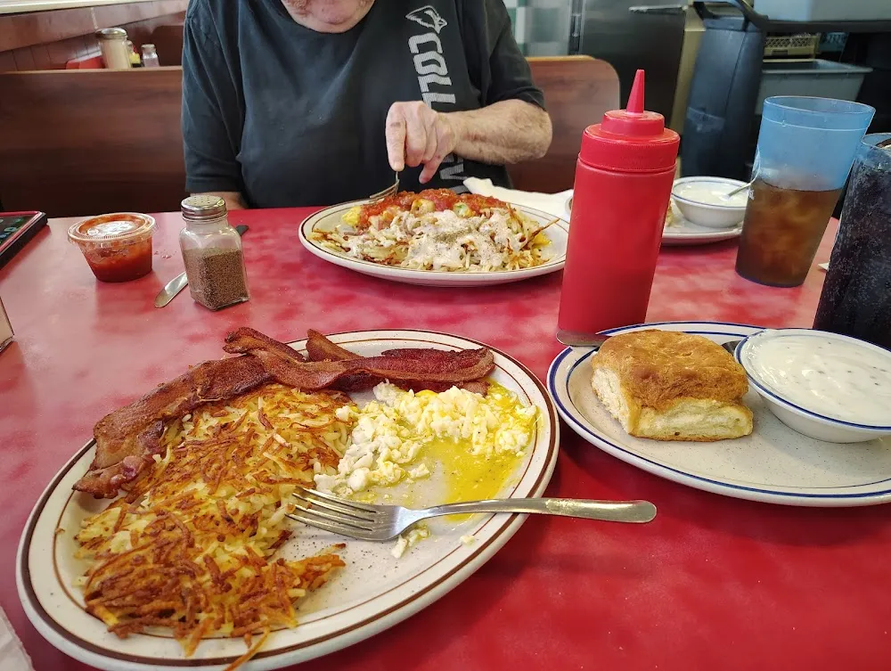 Biscuits and Gravy with Eggs Bacon and Hash Brown